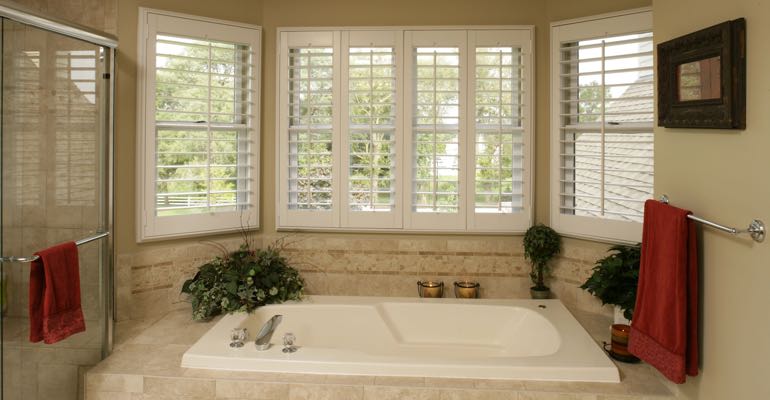 Plantation shutters in Austin bathroom.